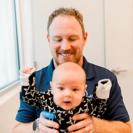 Chiropractor Bakersfield CA William Perry Adjusting Infant